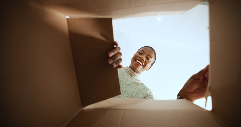 female looking into box