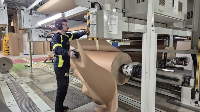 Victor in front of paper reel at the corrugator